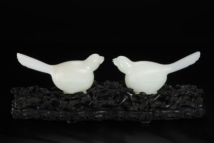 A pair of Chinese Qing Dynasty Hetian white jade magpie-carrying-lingzhi lidded boxes
