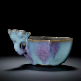 A Jun ware cup with sky-blue glaze and red handle from the Northern Song Dynasty in China.