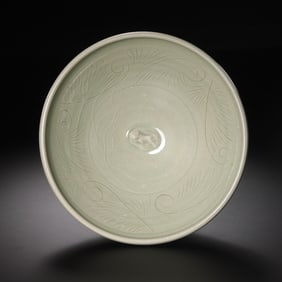 Moon-white glazed carved bowl from Yaozhou kiln during the late Tang and Five Dynasties period,