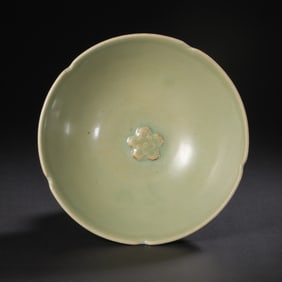 Large celadon bowl with a flower-shaped rim and plum blossom design from the Longquan kiln during