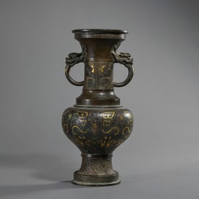 A double-eared, dish-mouthed vase inlaid with gold and silver from the Warring States period of