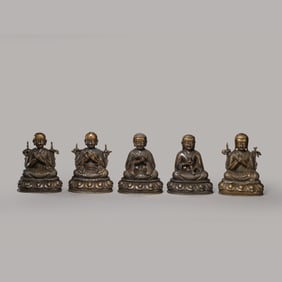 A set of seated Buddha statues made of alloy bronze from the Qing Dynasty of China