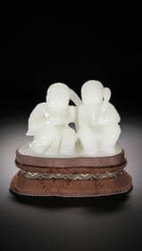 Chinese Qing Dynasty Hetian white jade seated boy statue