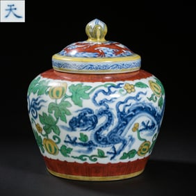 A covered jar with dragon design and the character "?" (tian) from the Chenghua period of the Ming