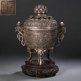 A pure silver double-eared, three-legged covered incense burner from the Qianlong period of the Qing