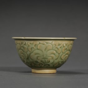 A celadon-glazed, carved flower-shaped cup from the Yaozhou kiln during the late Tang and Five