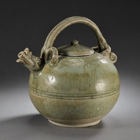 A celadon ewer with a dragon-head handle from the Yue kiln during the Northern and Southern