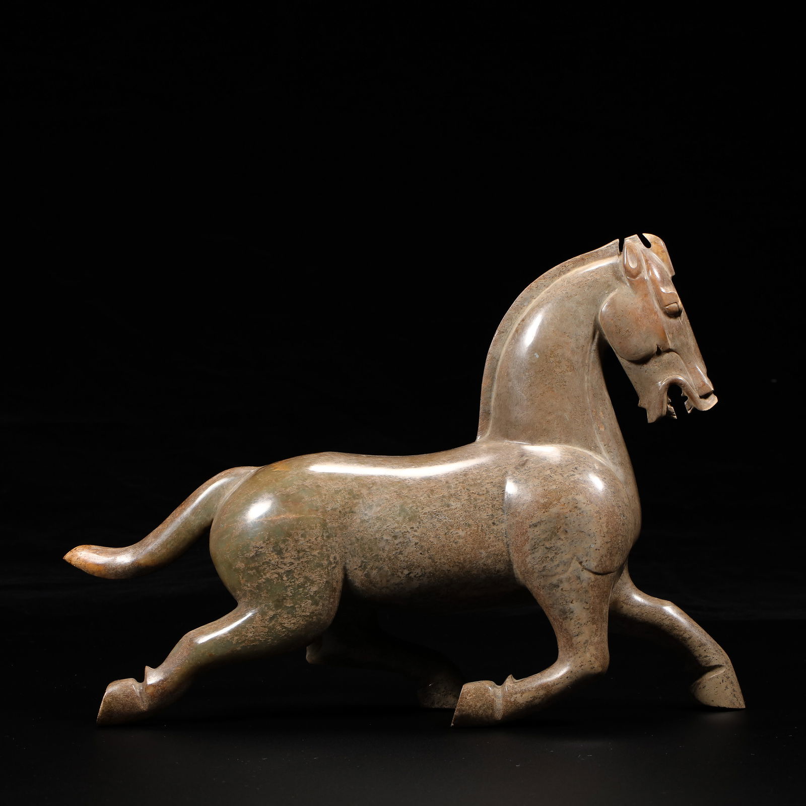 Jade Horse Treading on a Flying Swallow from the Han Dynasty in China: H. 21.5 cm. W. 28 cm. Weight. 2680 gram.