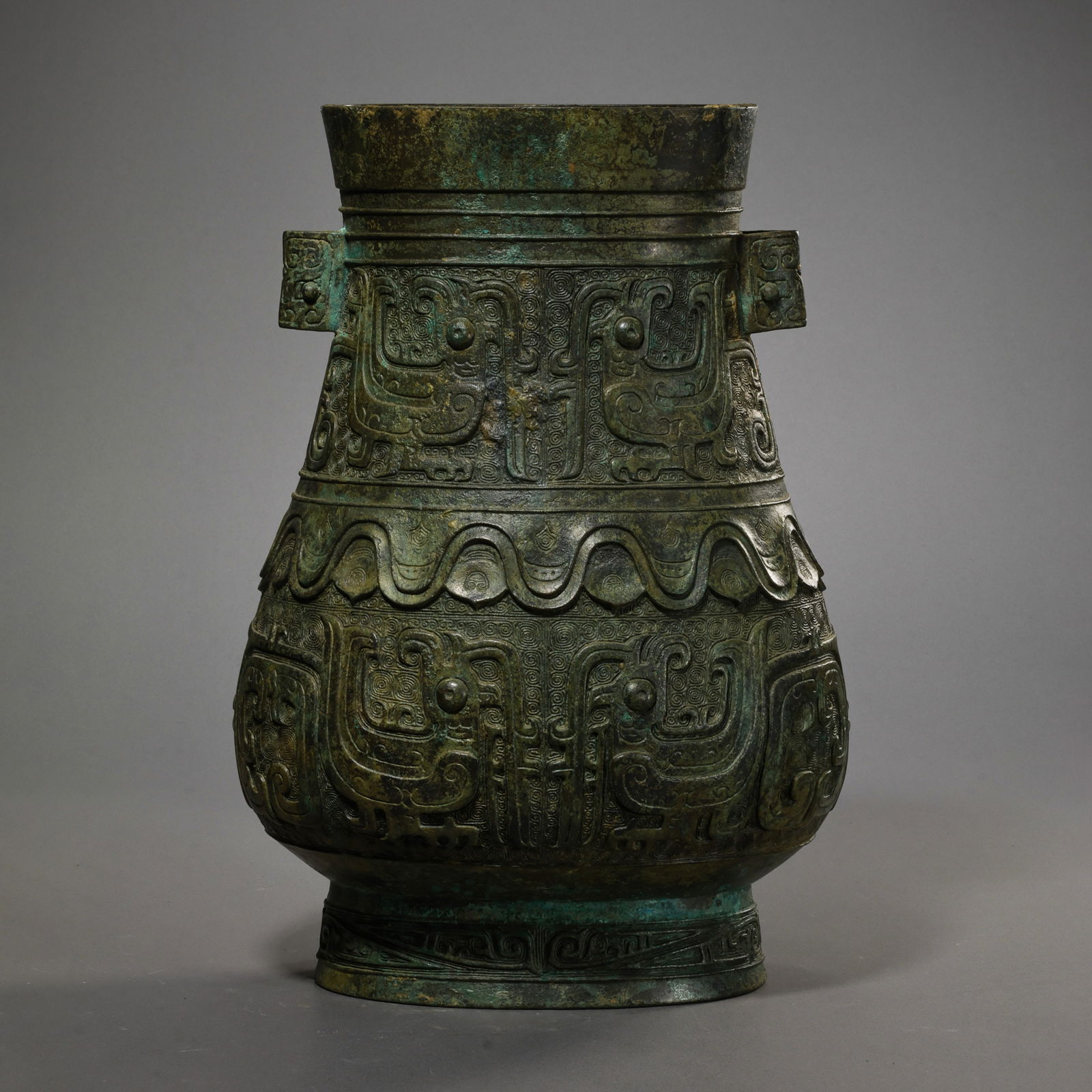 Bronze vase with animal mask design and tubular handles from the Shang and Zhou Dynasties of China (1 of 11)