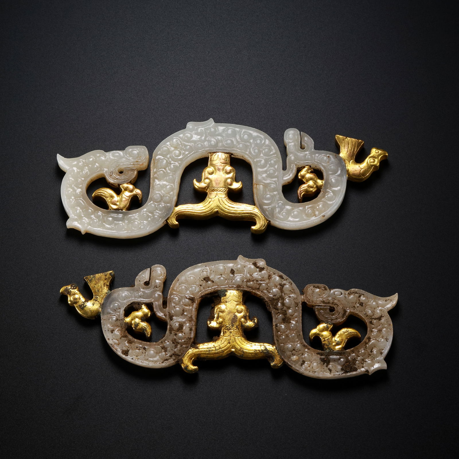 A pair of Chinese Han Dynasty gold-plated jade dragon pendants (1 of 9)