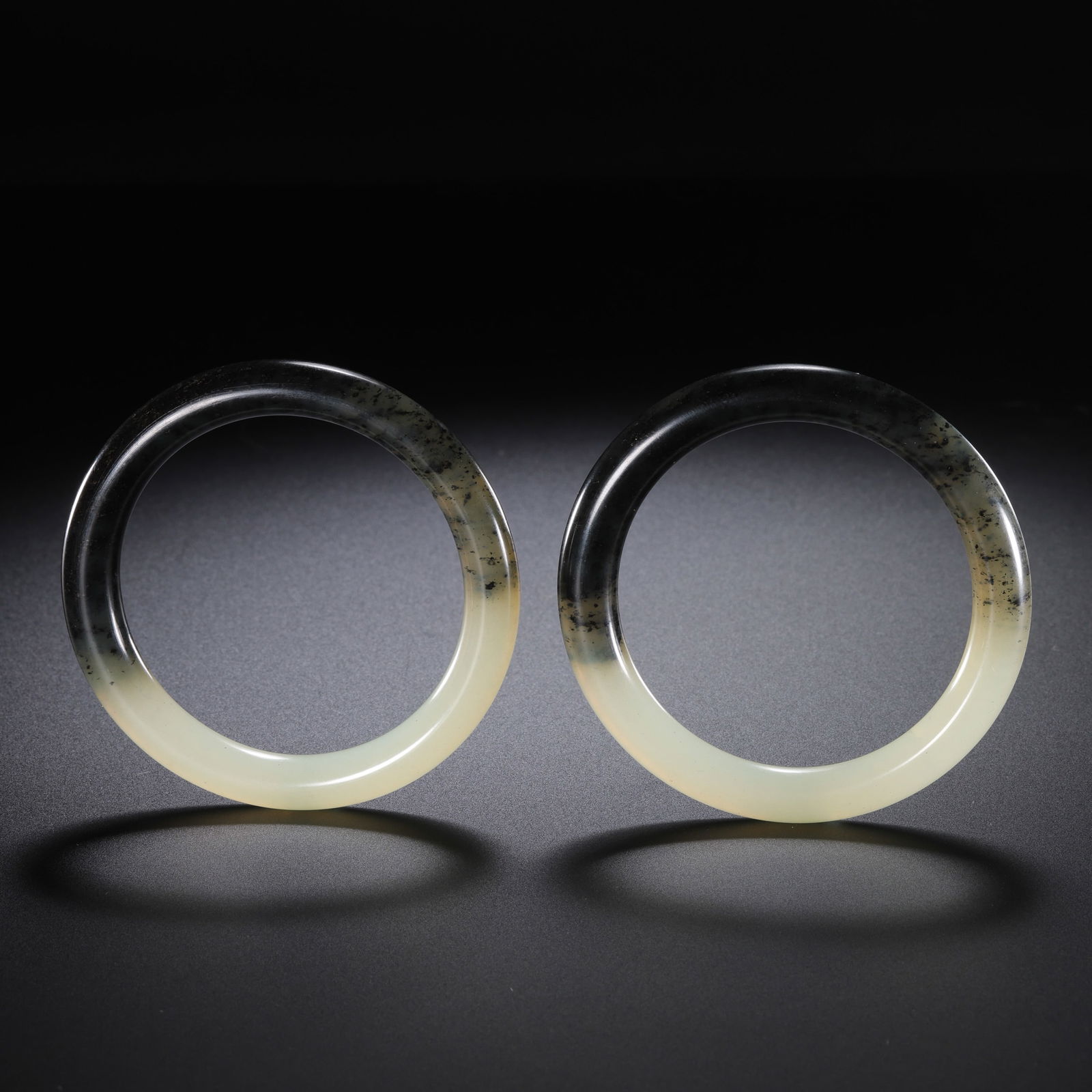 A pair of Chinese Qing Dynasty Hetian jade bracelets (1 of 8)