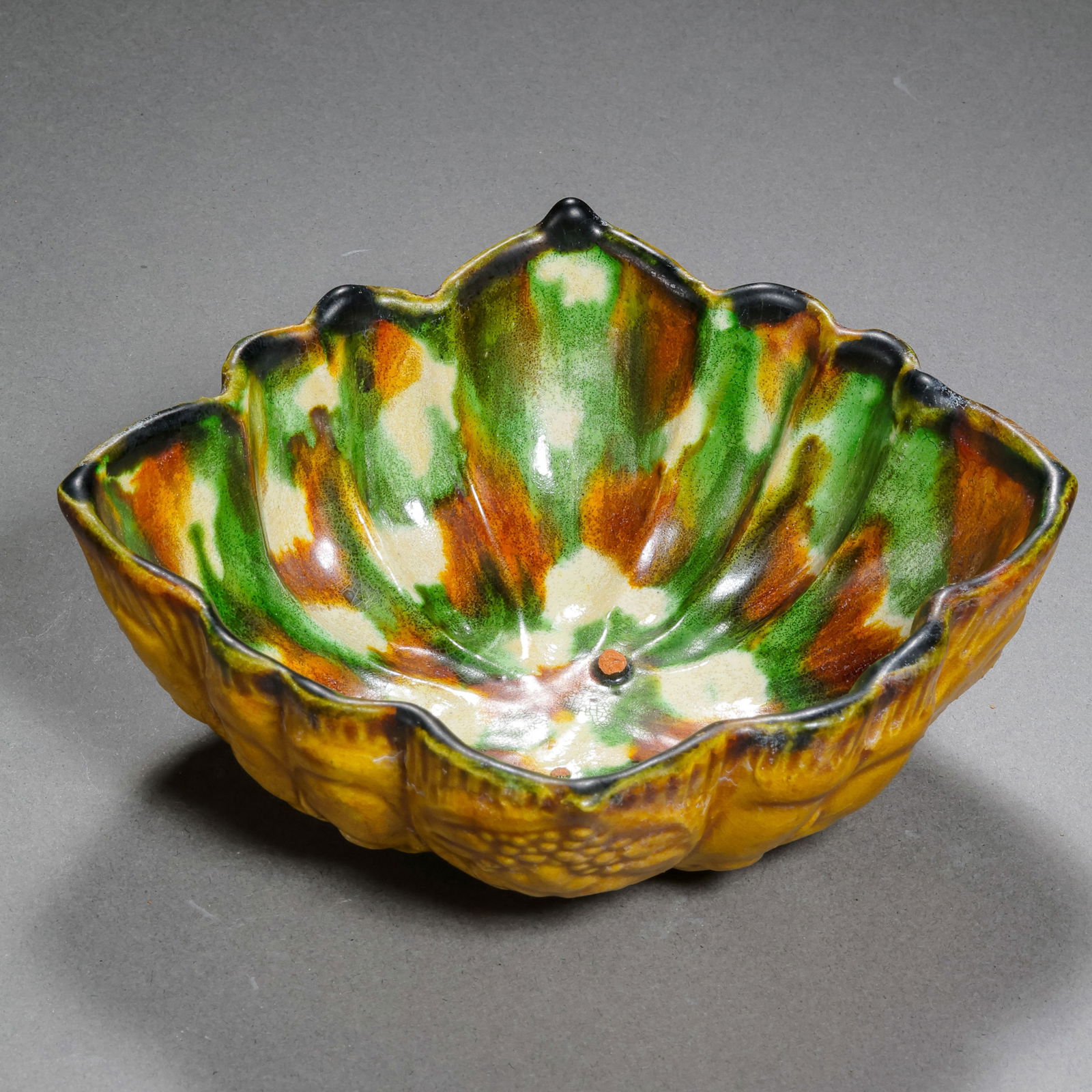 Chinese Tang Dynasty Tricolor Glazed Diamond-Shaped Hand Cup: H. 4 cm. L. 11.2 cm.