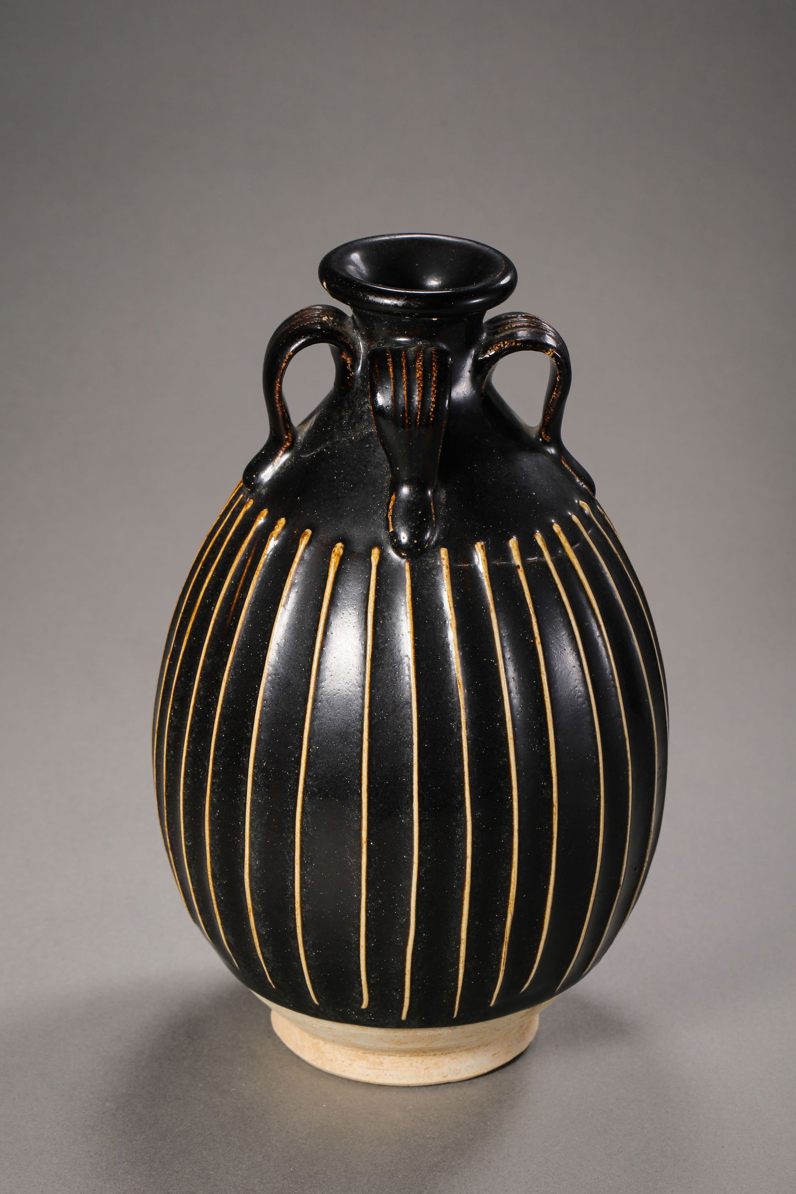 A black-glazed four-handled bottle from the Cizhou kiln of the Northern Song Dynasty in China. (1 of 9)