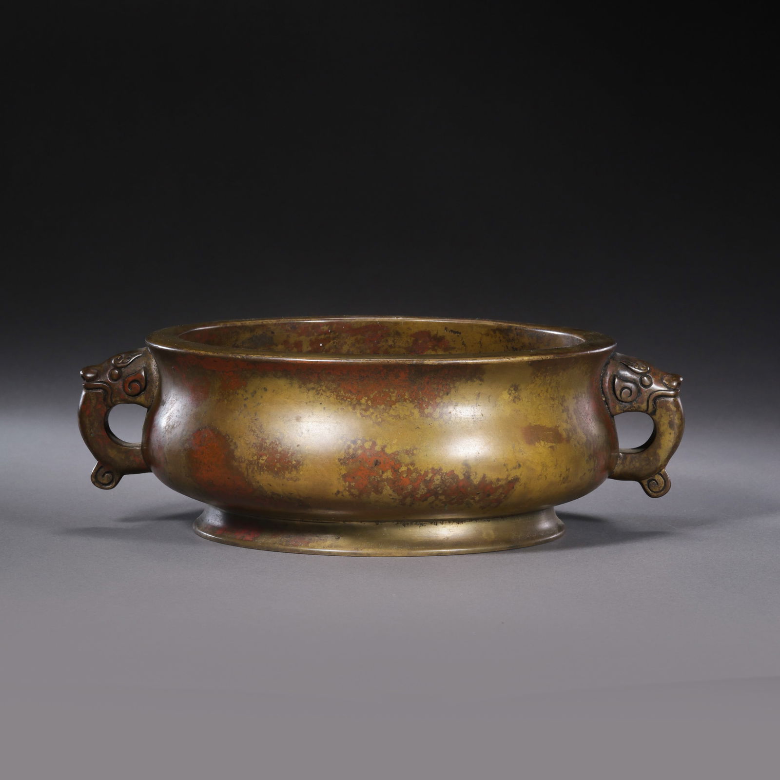 Double-eared bronze censer from the Xuande period of the Ming Dynasty, China: H. 6.2 cm. W. 20 cm. Weight. 1798 gram.