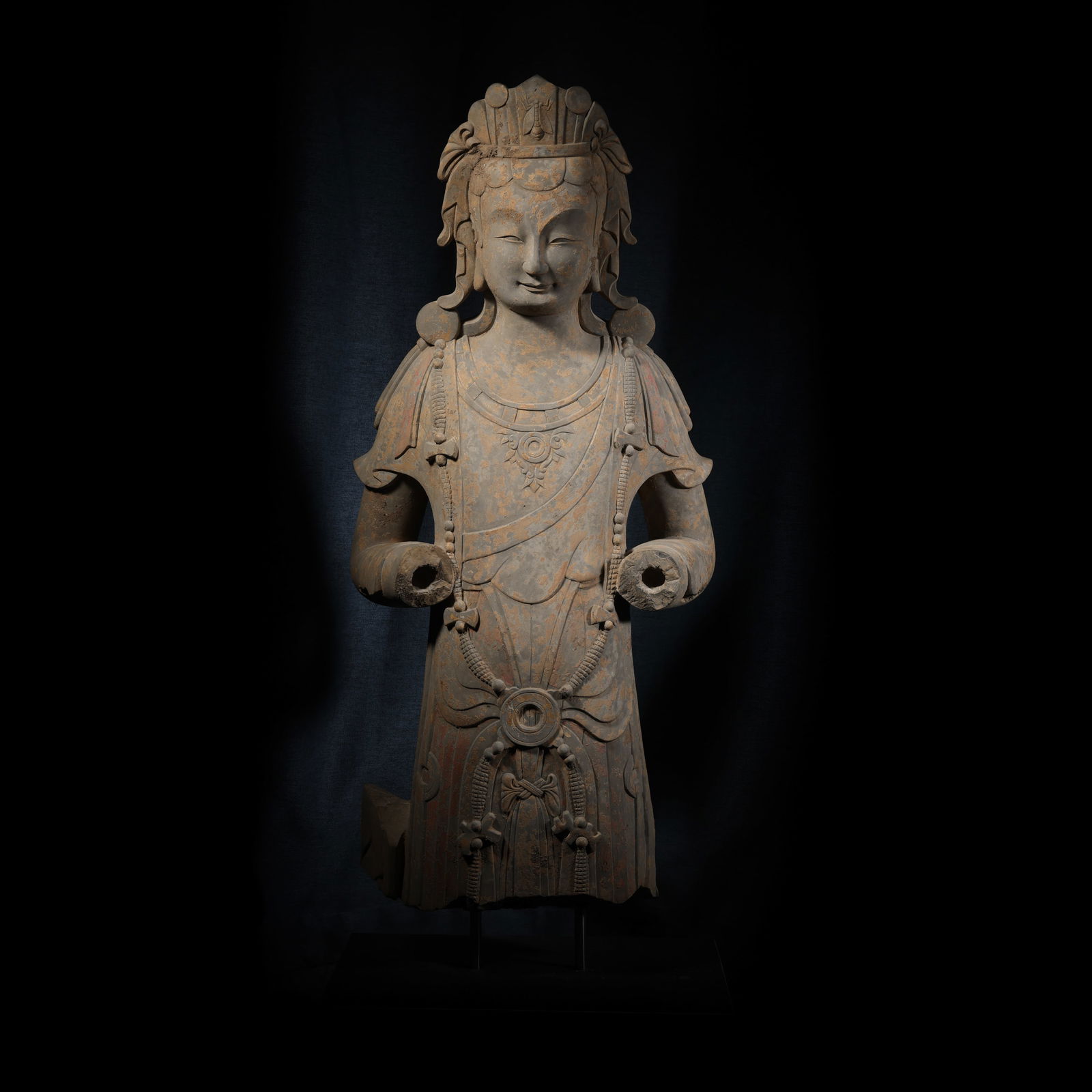 A standing Buddha statue painted on bluestone during the Northern Wei Dynasty in China: H. 90 cm. W. 37 cm.