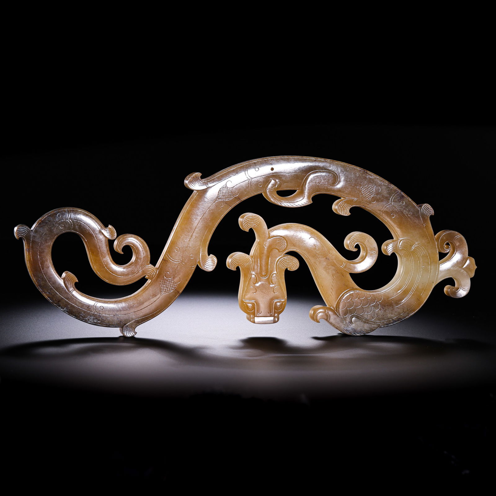 Jade Dragon from the Han Dynasty in China: L. 23.2 cm. W. 8.5 cm. Weight. 219 gram.
