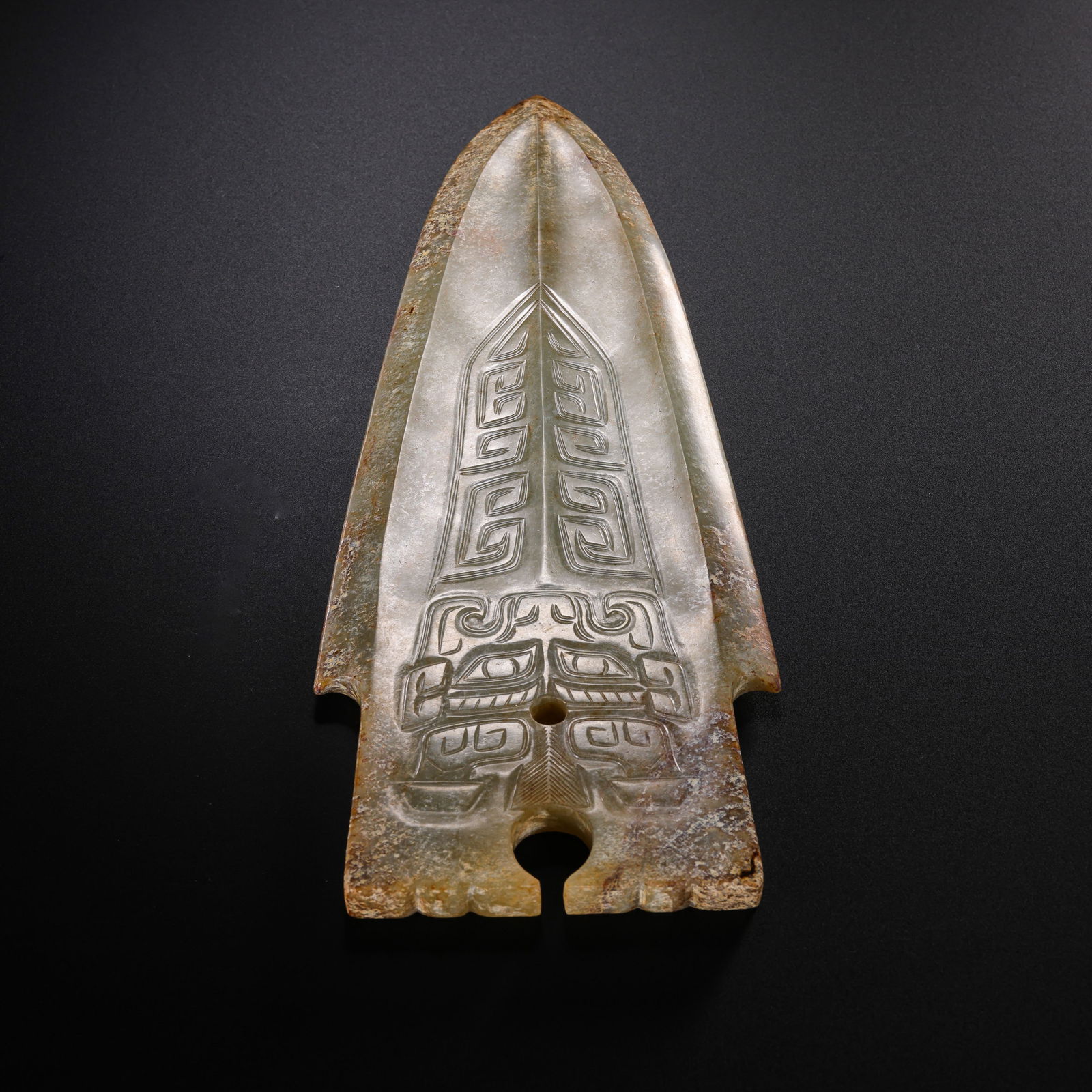 Jade Ge with Beast-Face Pattern from the Warring States Period in China: L. 21.5 cm. W. 9 cm. Weight. 293 gram.