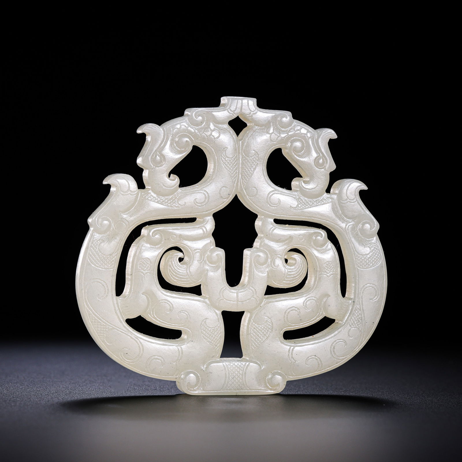 Chinese Han Dynasty White Jade Double Phoenix Pendant: L. 6.2 cm. W. 6 cm. Weight. 33 gram.