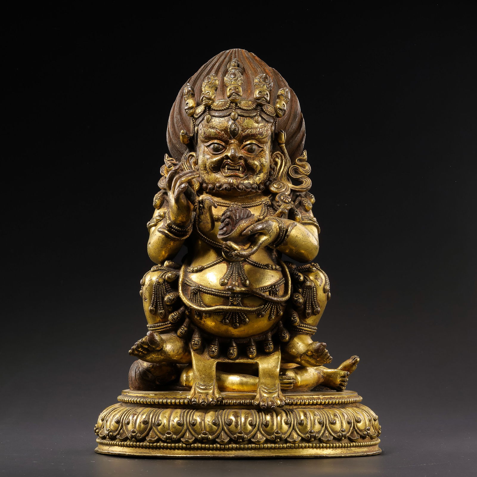 A standing bronze statue of the God of Wealth from the Ming Dynasty in China: H. 23 cm. W. 19 cm. Weight. 3939 gram.