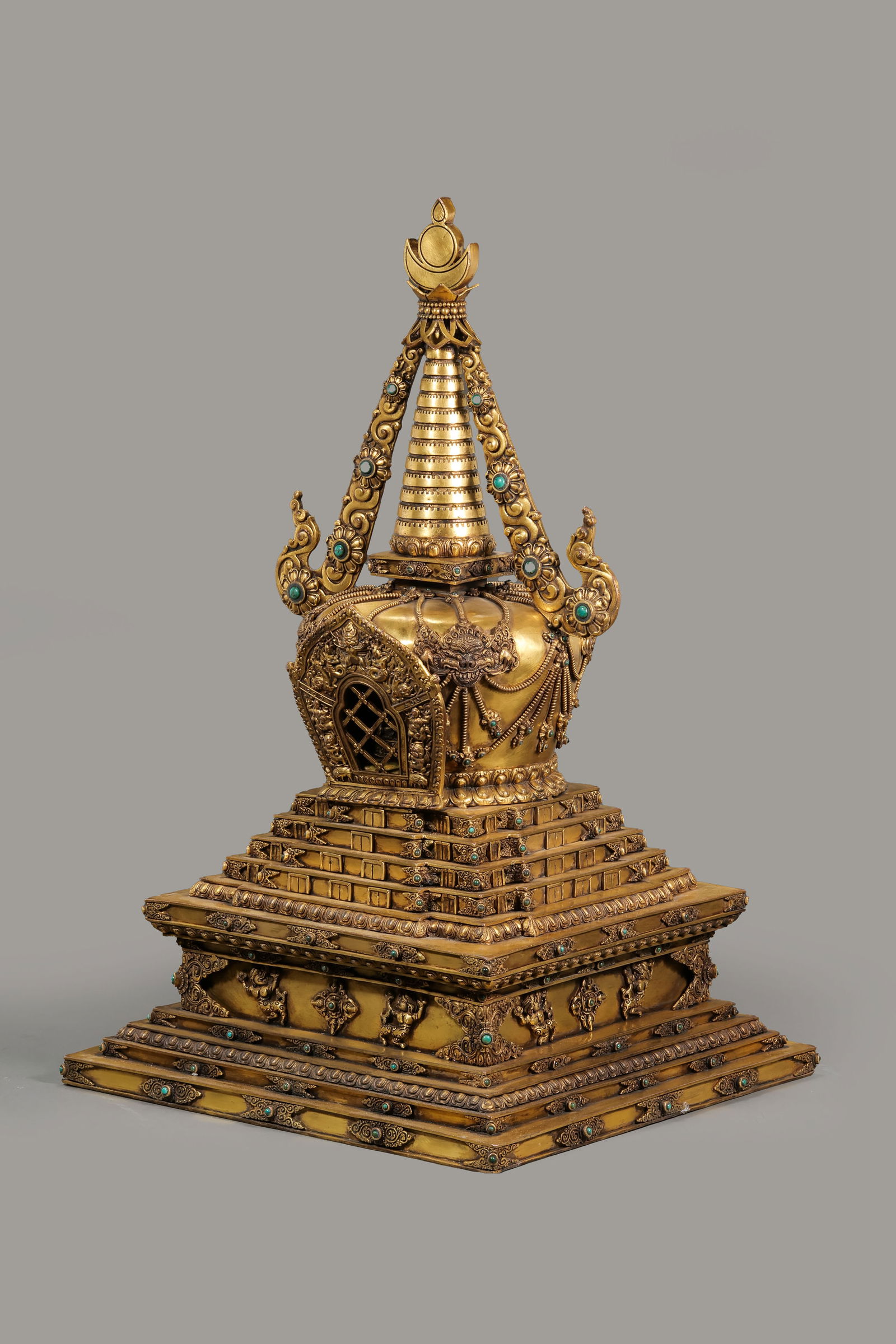A gilt bronze pagoda inlaid with turquoise from the Kangxi period of the Qing Dynasty in China.: H. 74 cm. W. 45 cm. Weight. 33200 gram.