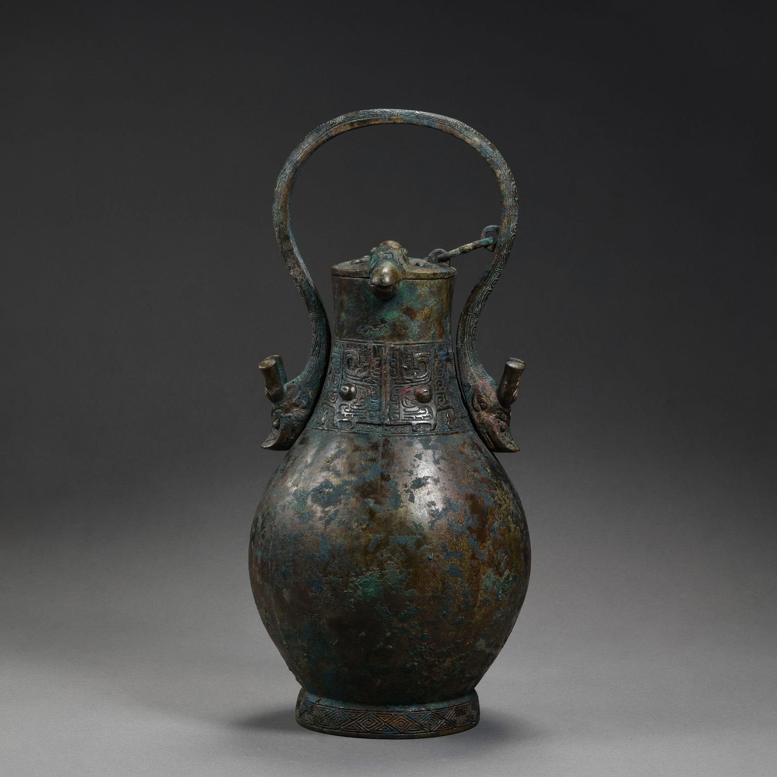 A bottle with animal mask design and handle from the Warring States period of China: /