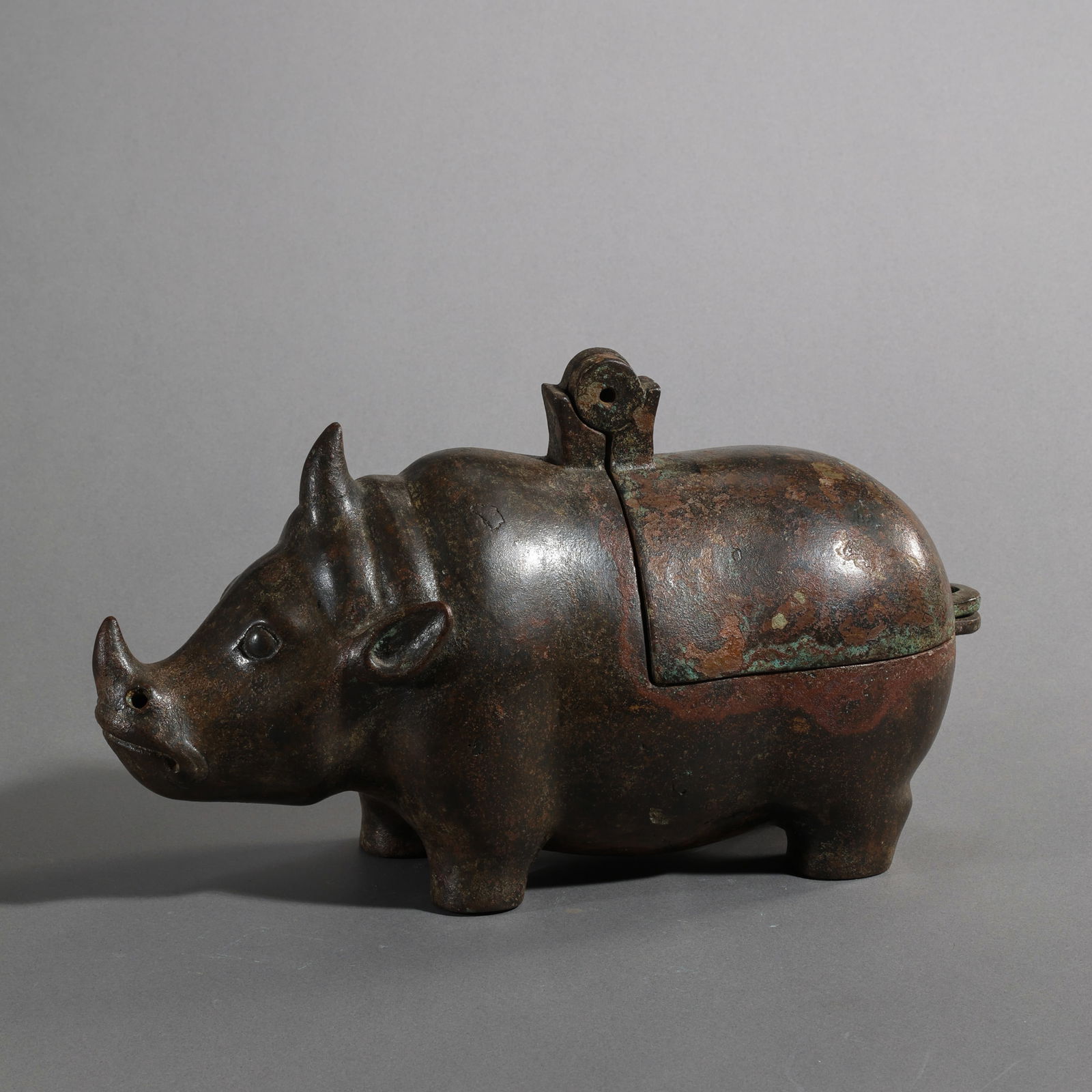 Chinese Han Dynasty Bronze Rhinoceros Incense Burner: H. 16.5 cm. W. 28 cm. Weight. 2050 gram.