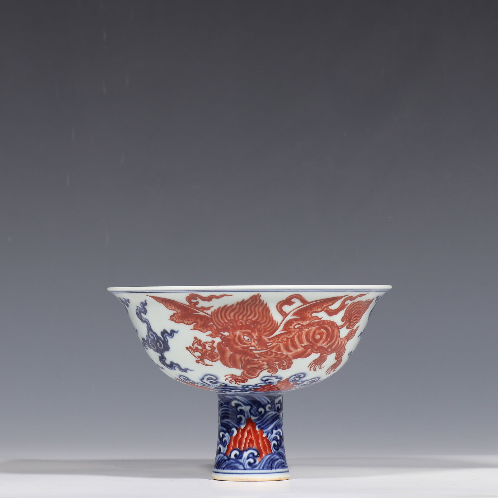 Blue and white porcelain stem cup with auspicious beast design from the Xuande period of the Ming: H. 12.2 cm. Diam. 17.6 cm.