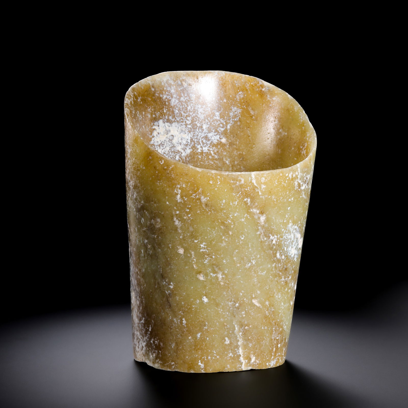 Jade horseshoe from the Hongshan Culture of the Hongshan Period in China: H. 14.5 cm. W. 9.7 cm. Weight. 578 gram.