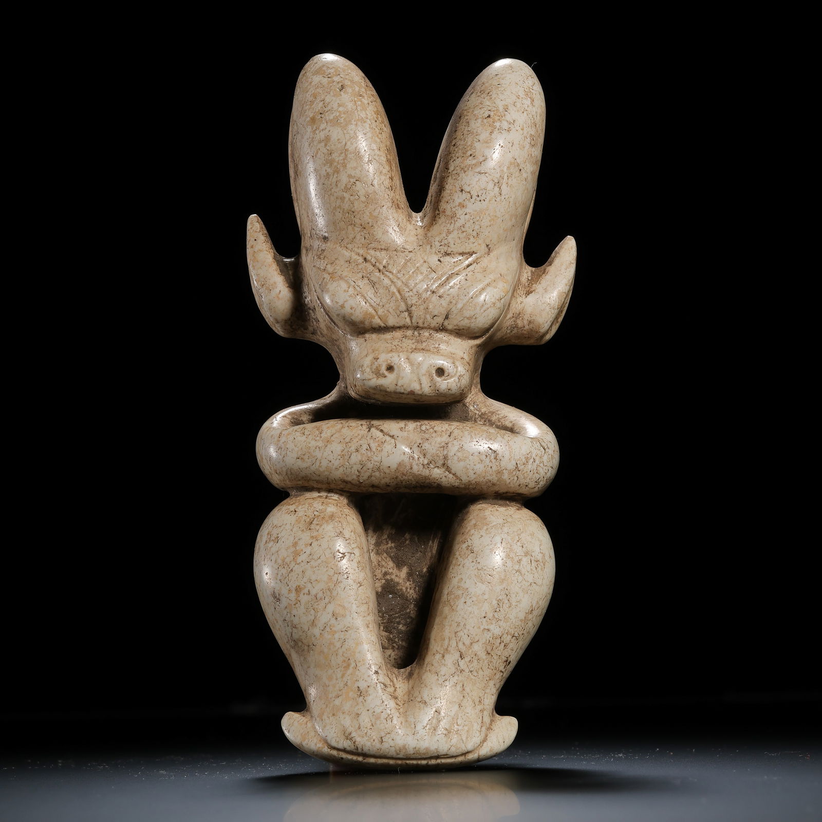 Chicken-bone white jade sun god from the Hongshan Culture of the Neolithic period in China: L. 12 cm. W. 4 cm. Weight. 241 gram.