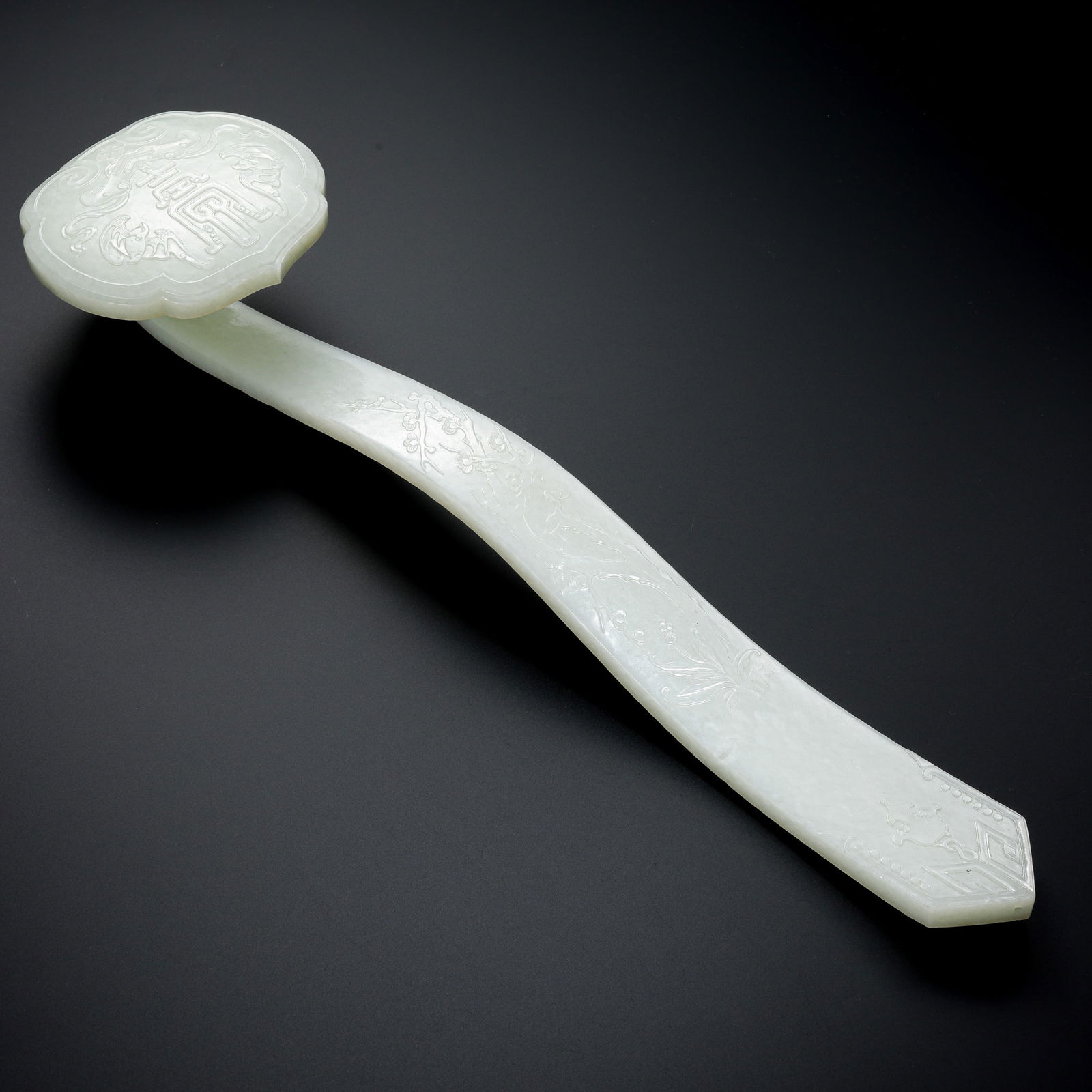 Chinese Qing Dynasty Hetian white jade Ruyi ornament: L. 43 cm. W. 11 cm. Weight. 810 gram.