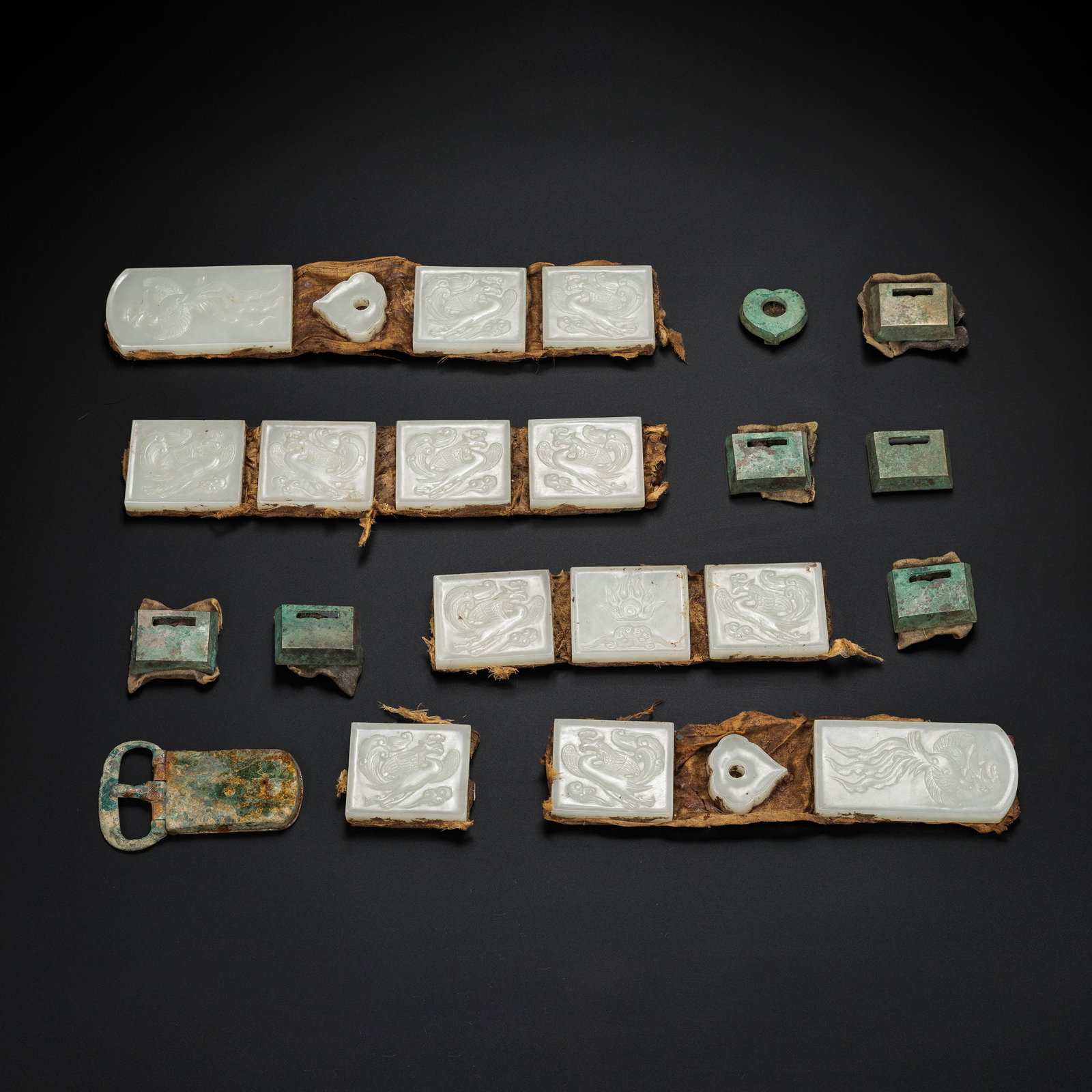 A set of Hetian white jade belt plaques from the Liao Dynasty, China: L. 8.3 cm. W. 4.1 cm. L. 4.9 cm. L. 3.2 cm. Weight. 1033 gram.