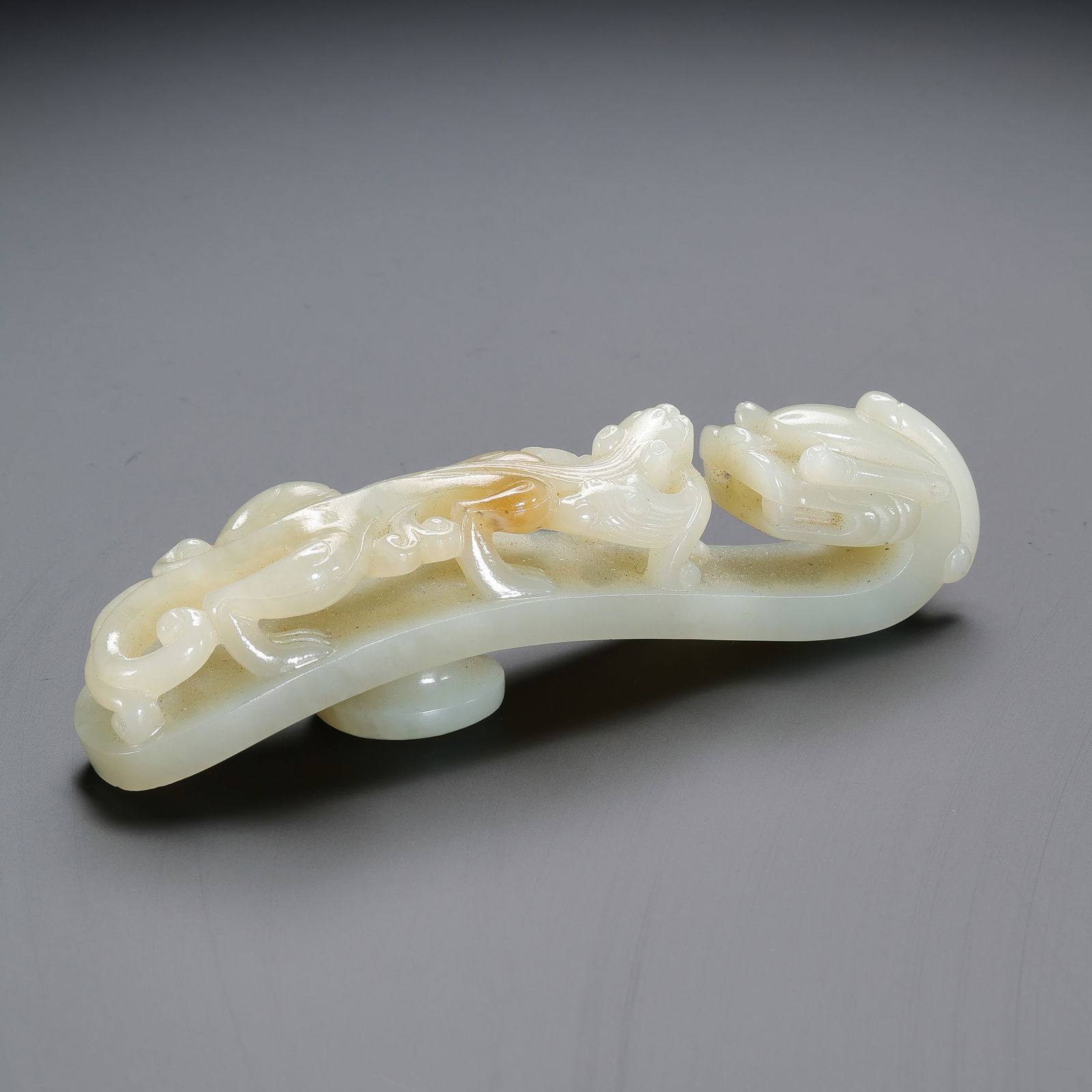 Chinese Qing Dynasty Hetian white jade dragon belt hook: L. 11.5 cm. W. 3 cm. Weight. 91 gram.