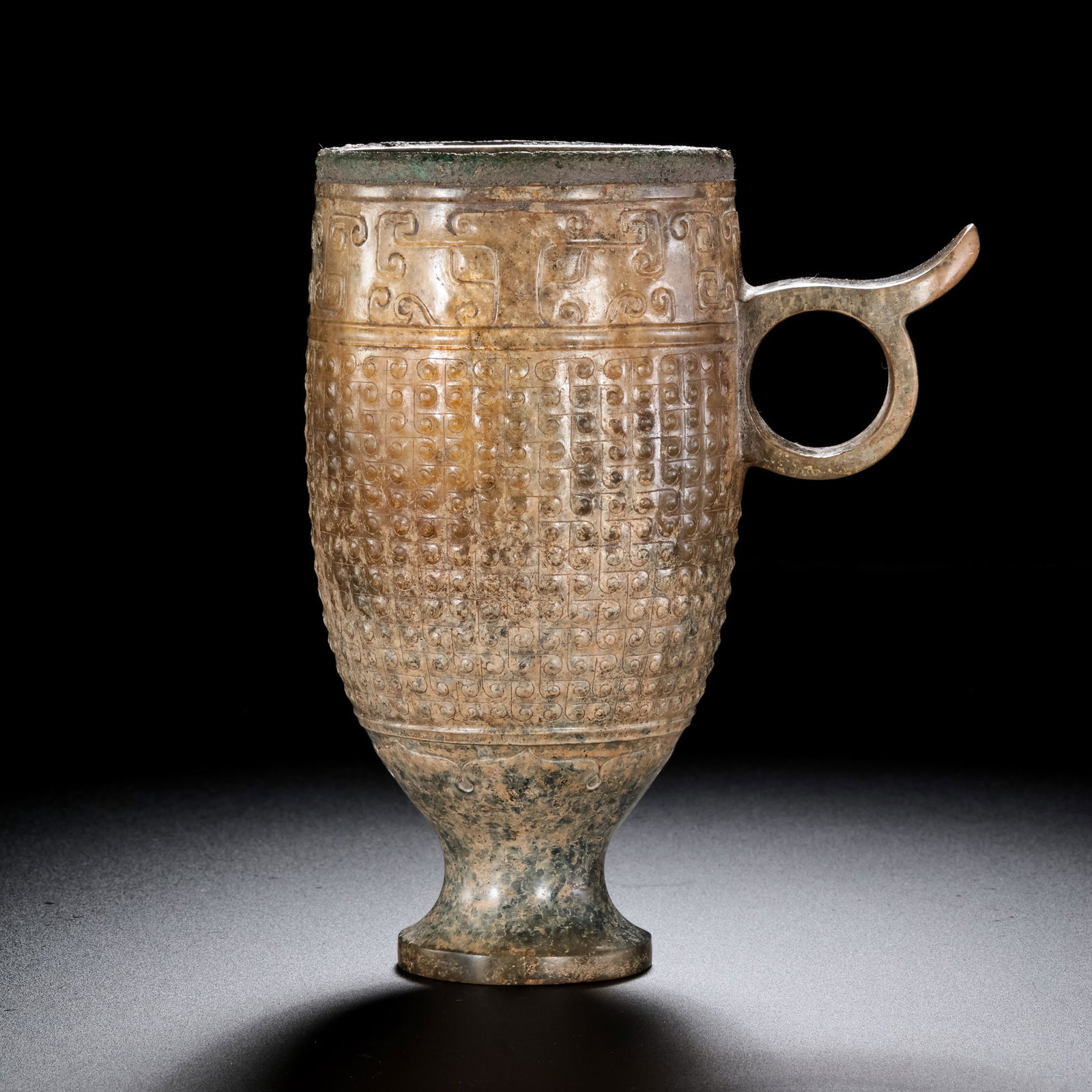 Jade cup with cloud pattern from the Warring States period of China: H. 12 cm. W. 9.5 cm. Weight. 191 gram.