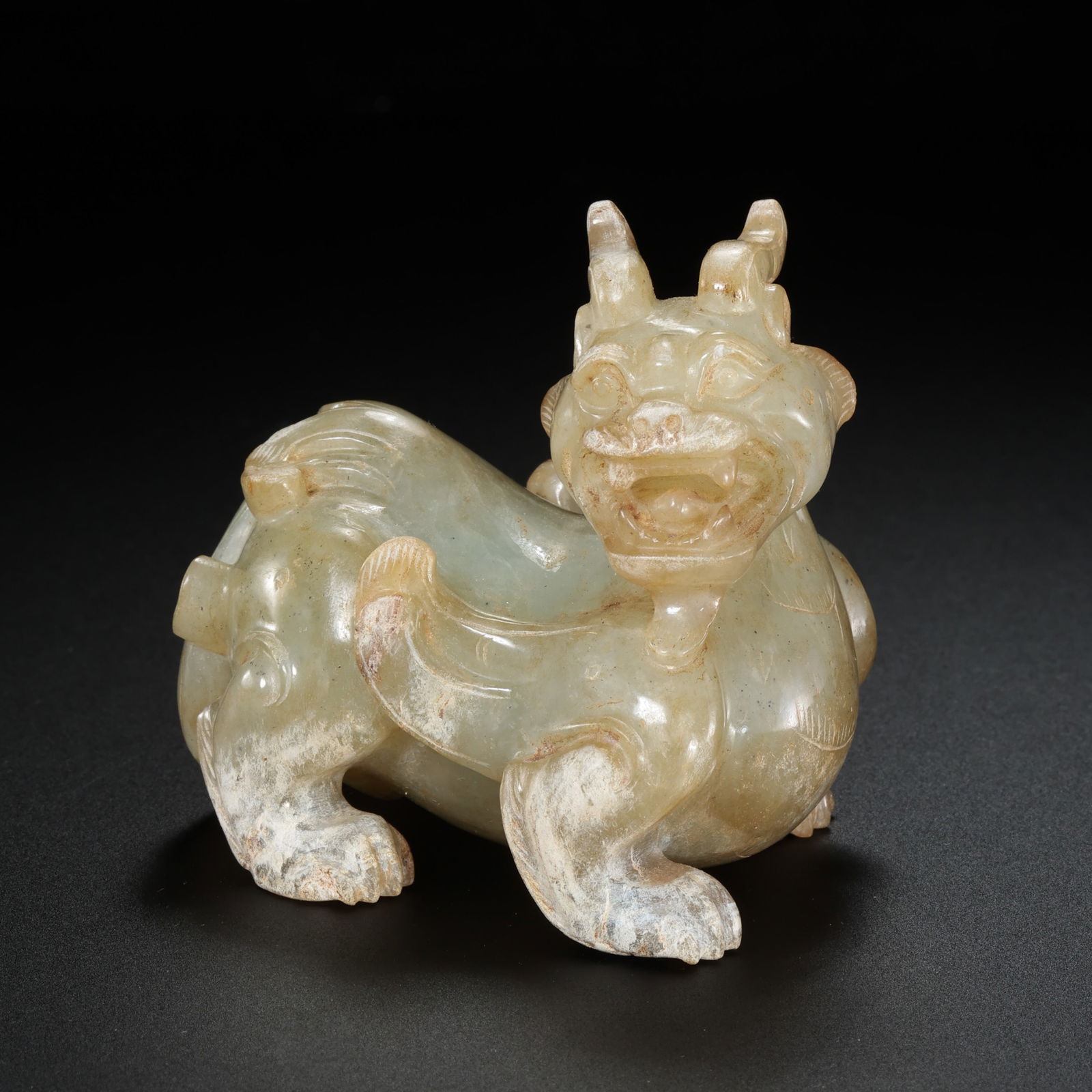 Jade auspicious beasts from the Han Dynasty in China: H. 4.3 cm. W. 5.5 cm. Weight. 139.4 gram.