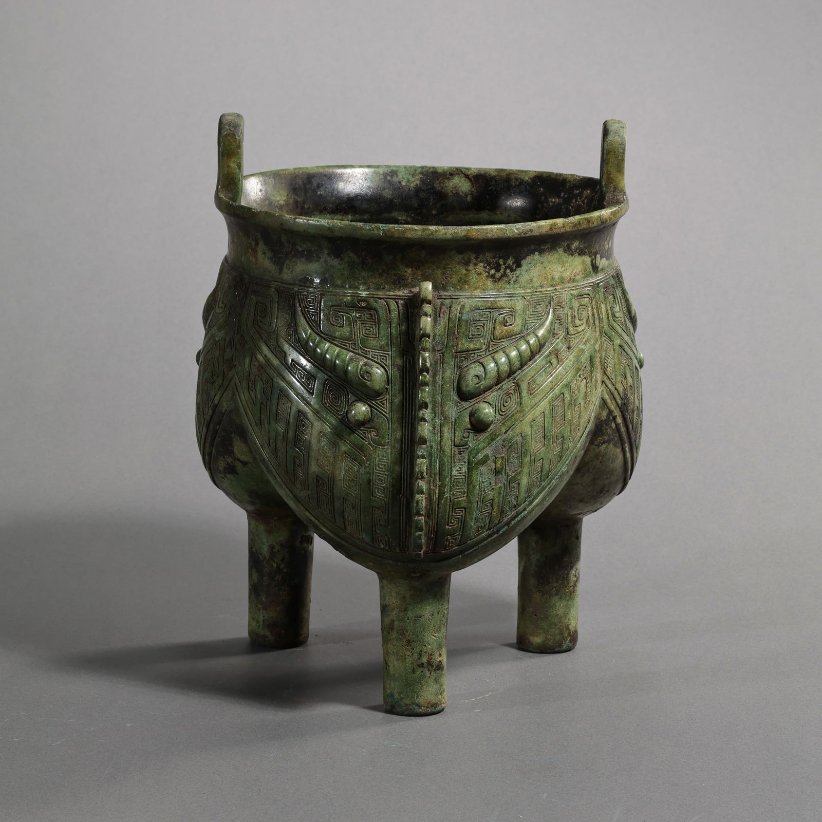 Three-legged censer with animal mask design from the Shang and Zhou Dynasties in China: H. 20 cm. W. 16 cm. Weight. 1500 gram.