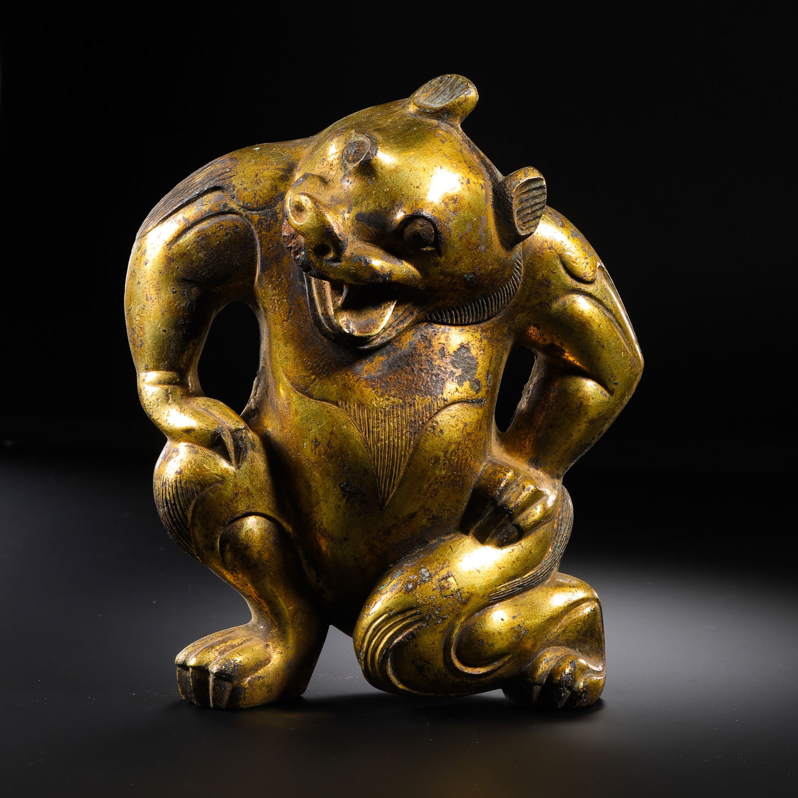 Chinese Han Dynasty Gilt Bronze Bear: H. 16.5 cm. W. 15 cm. Weight. 1400 gram.