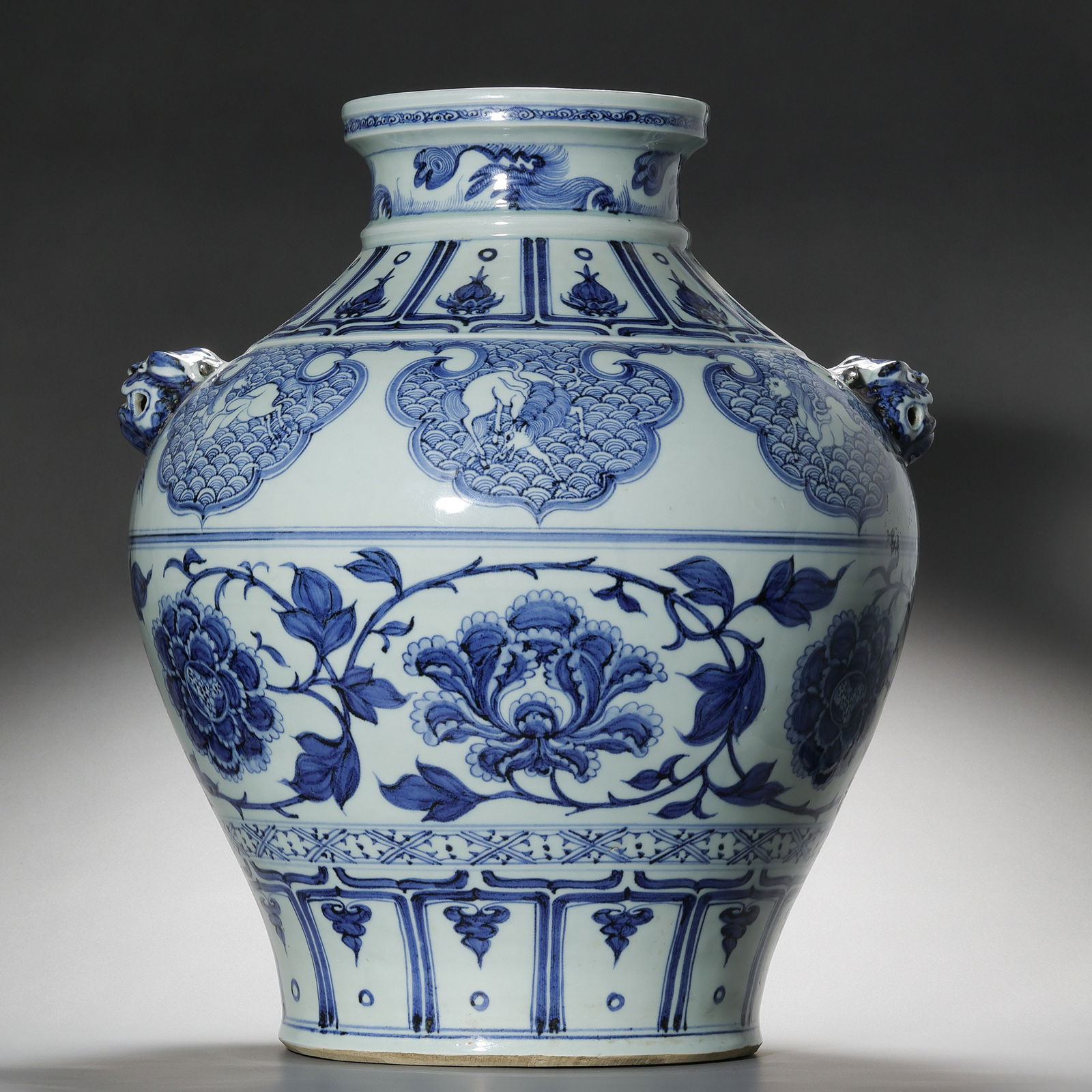 Chinese Yuan Dynasty Blue and White Porcelain Jar with Floral Design and Two Animal Heads with: H. 49 cm. W. 40 cm.
