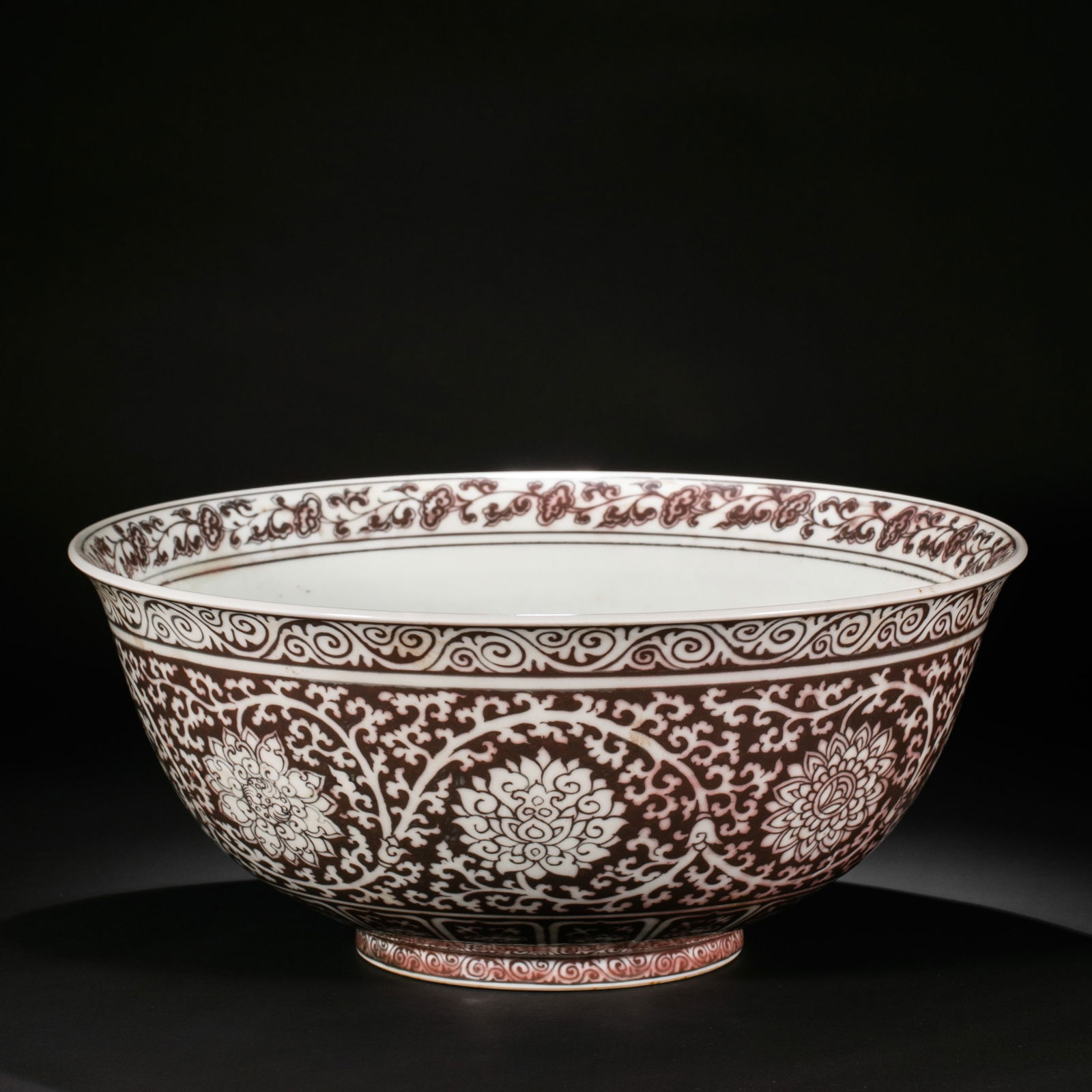 Chinese Ming Dynasty underglaze red bowl with intertwined floral pattern: H. 17 cm. Diam. 39 cm.