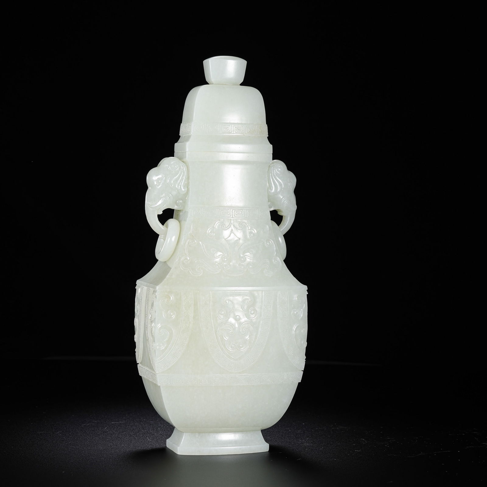 Chinese Qing Dynasty Hetian white jade double-ring-eared covered bottle: H. 25 cm. W. 10 cm. Weight. 1046 gram.