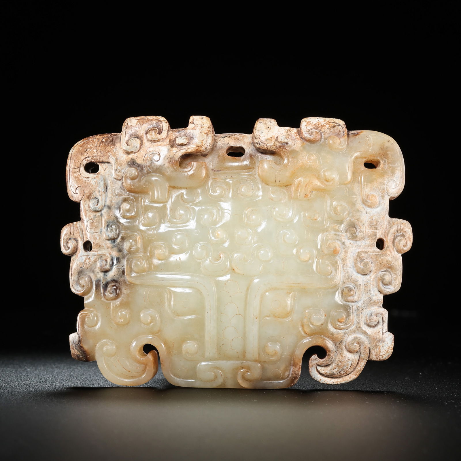 Chinese Warring States Period Bracelet with Hooked Cloud Pattern and Animal Face: H. 7 cm. W. 8.5 cm. Weight. 150 gram.