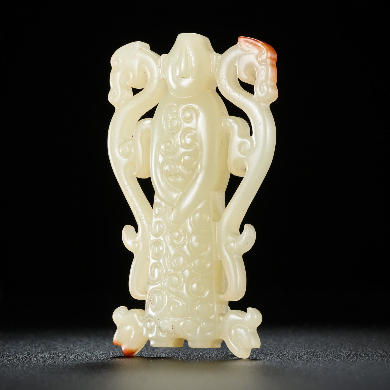 Double dragon and cloud pattern brocade from the Warring States and Han Dynasties in China: H. 6.3 cm. W. 3.5 cm. Weight. 34 gram.