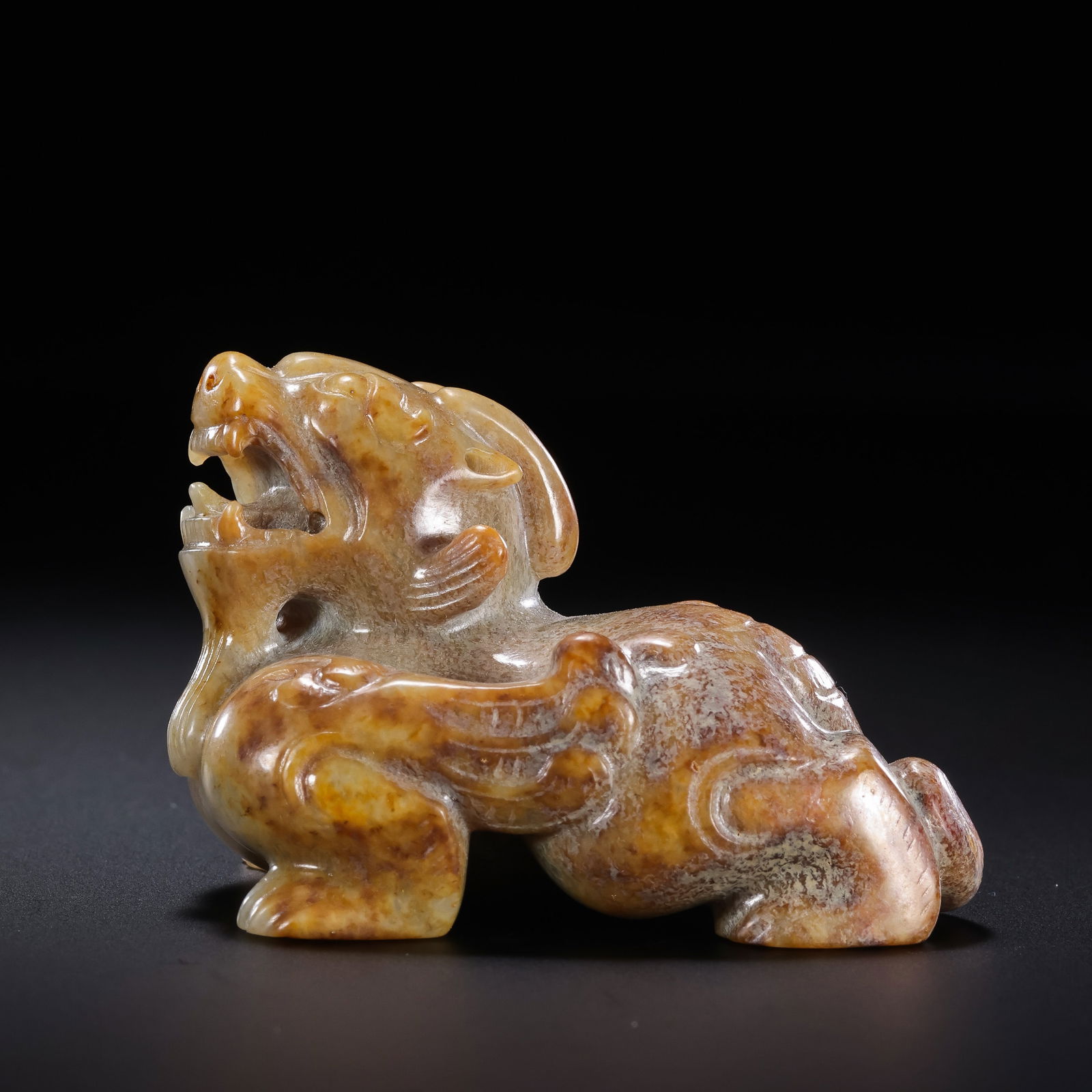 Jade auspicious beasts from the Han Dynasty in China: H. 3.5 cm. W. 5.5 cm. Weight. 76 gram.