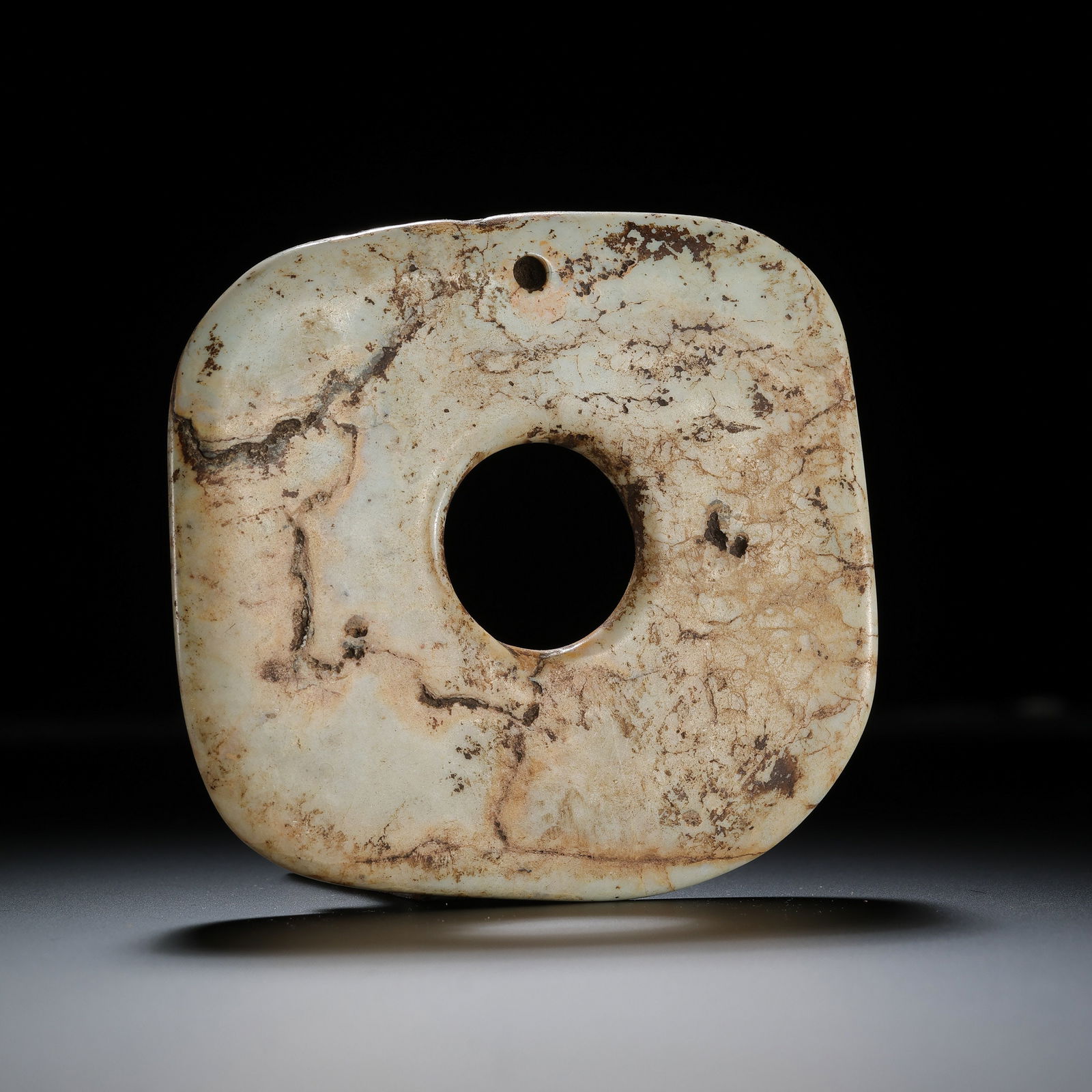 Hongshan Culture Jade Square Bi from the Hongshan Period in China: Diam. 9 cm. Weight. 85 gram.