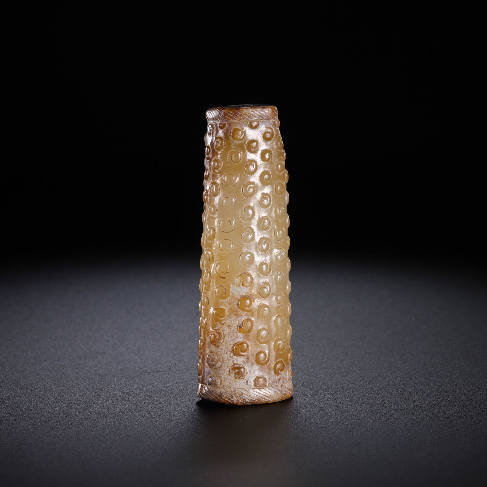 Jade pendant with cloud pattern from the Warring States period of China: H. 6.3 cm. W. 2 cm. Weight. 40 gram.