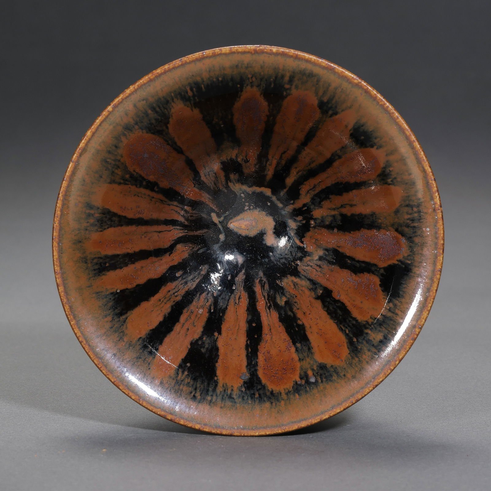 Iron-embroidered conical cup from Cizhou ware, Northern Song Dynasty, China: H. 5.2 cm. Diam. 11.5 cm.