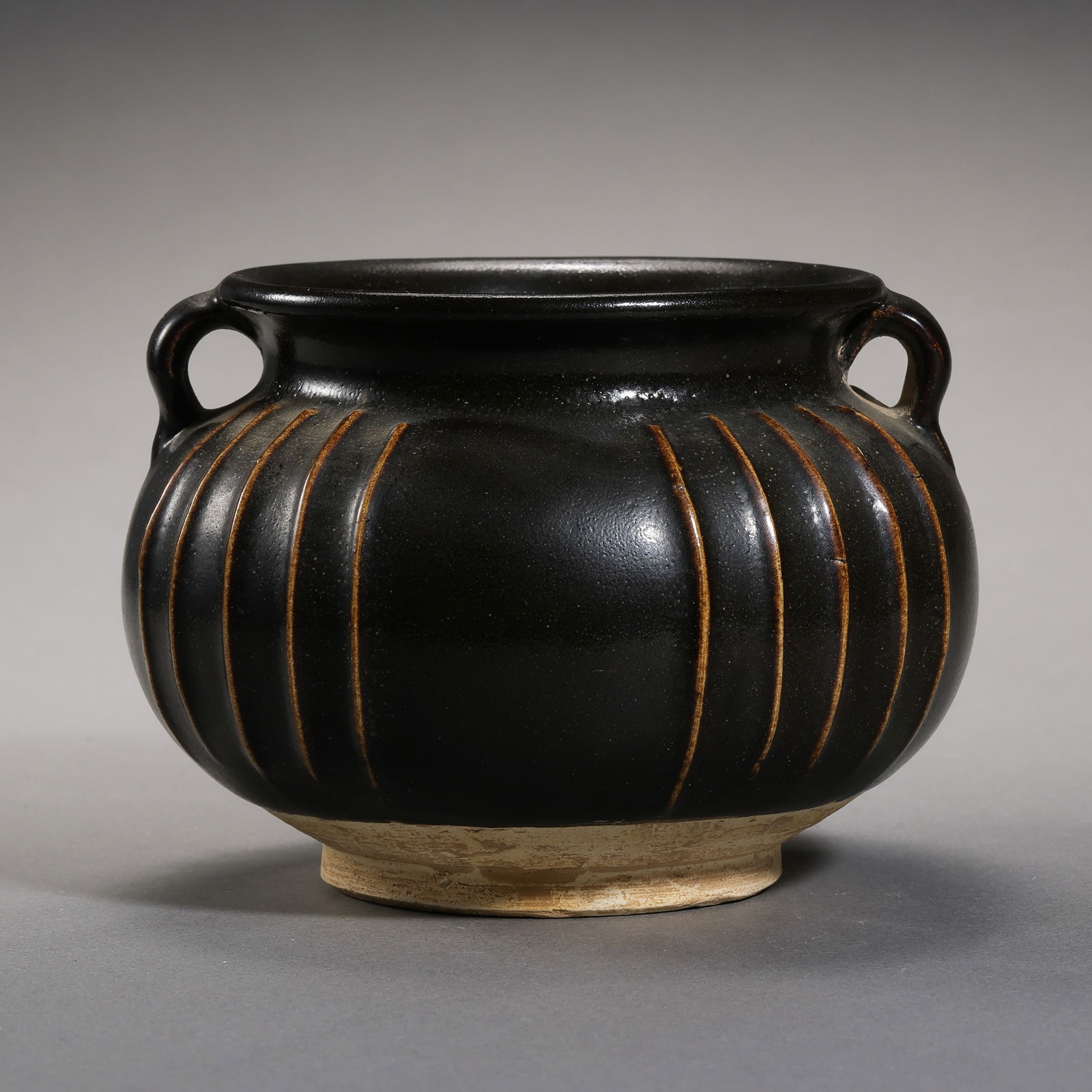 Northern Song Dynasty Cizhou Kiln Black Glazed Double-Handled Jar: H. 8.5 cm. W. 12 cm.