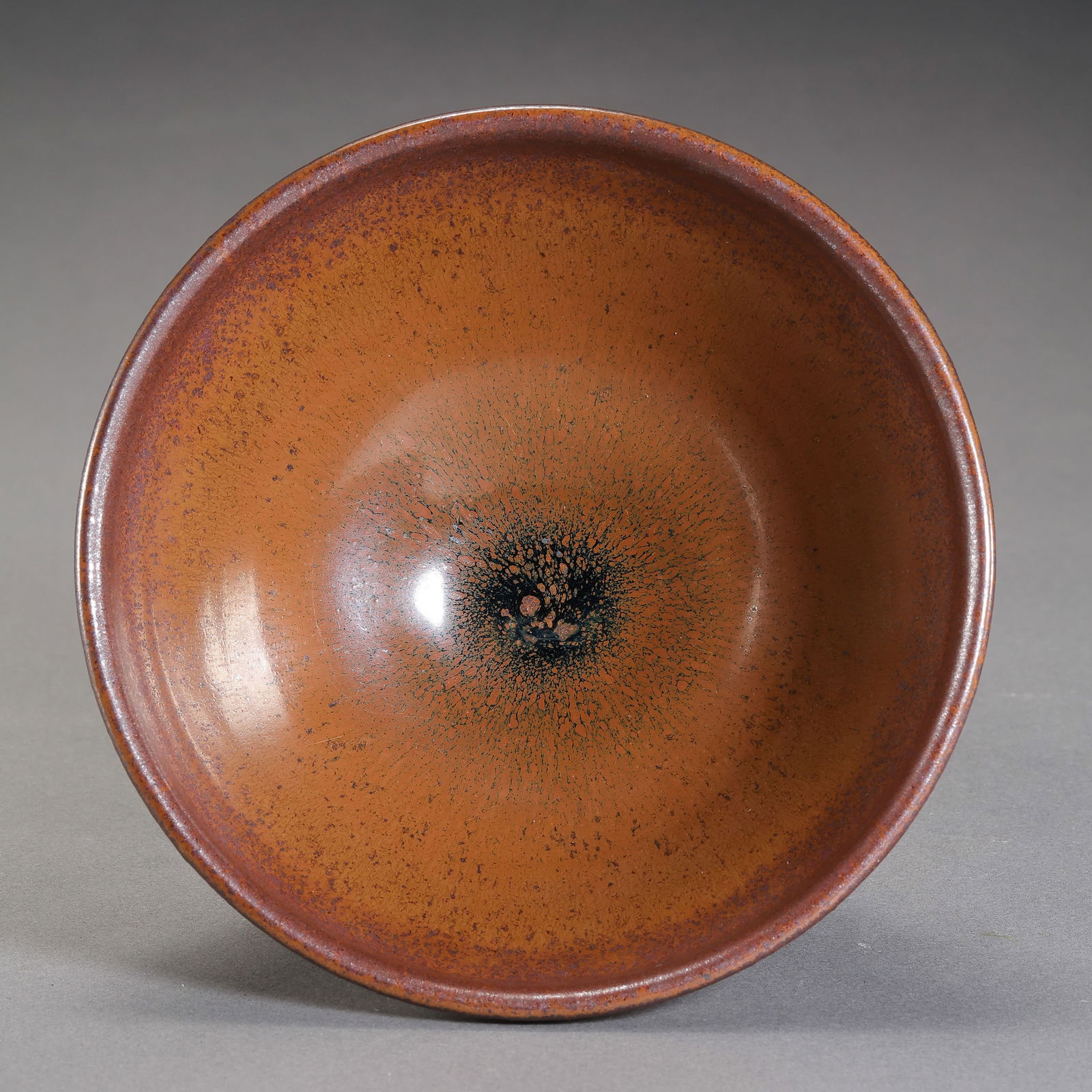 Persimmon-red glazed cup from Jian kiln in the Southern Song Dynasty, China: H. 6.3 cm. Diam. 12.9 cm.