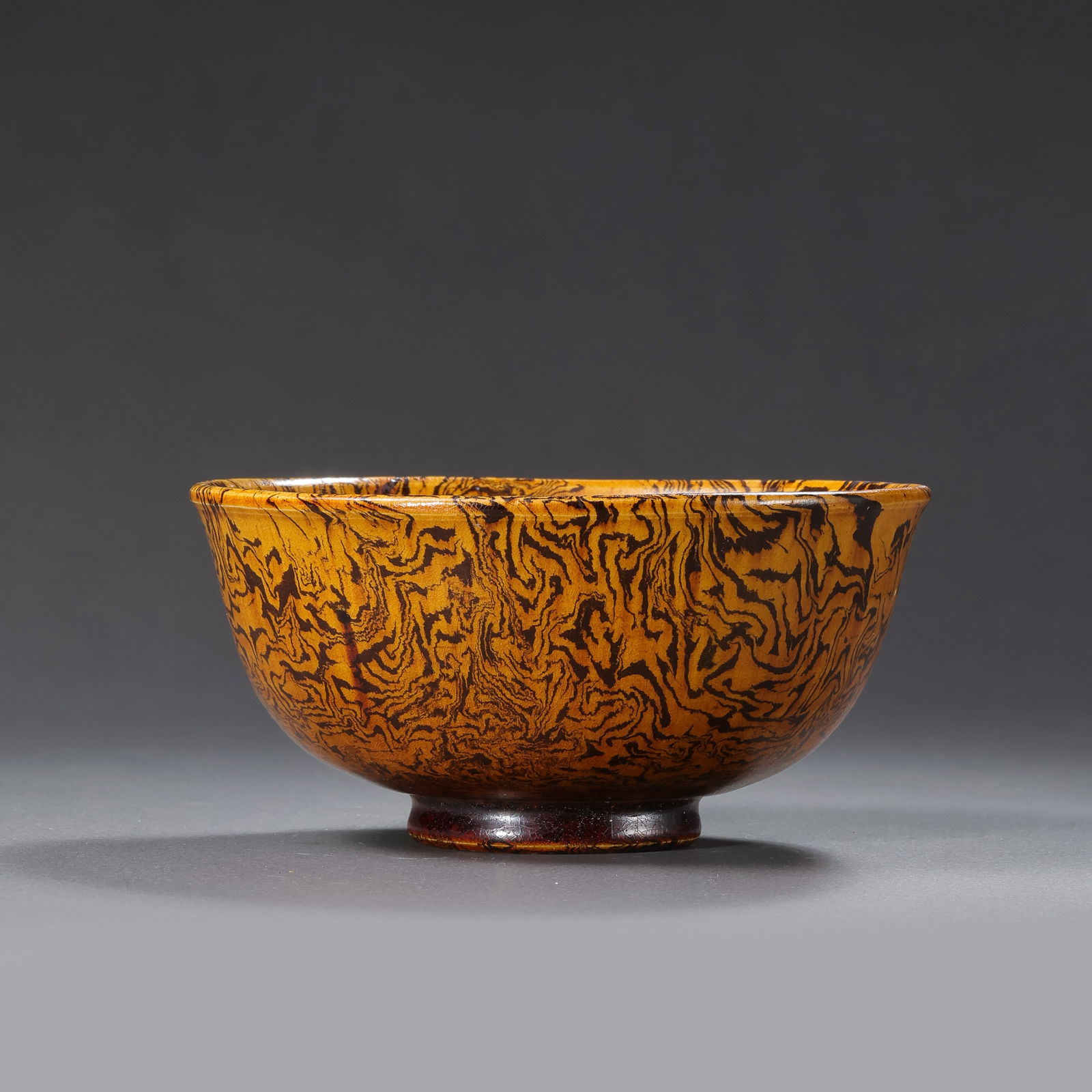 Chinese Tang Dynasty Yellow Glazed Marbled Bowl: H. 5.2 cm. Diam. 11 cm.