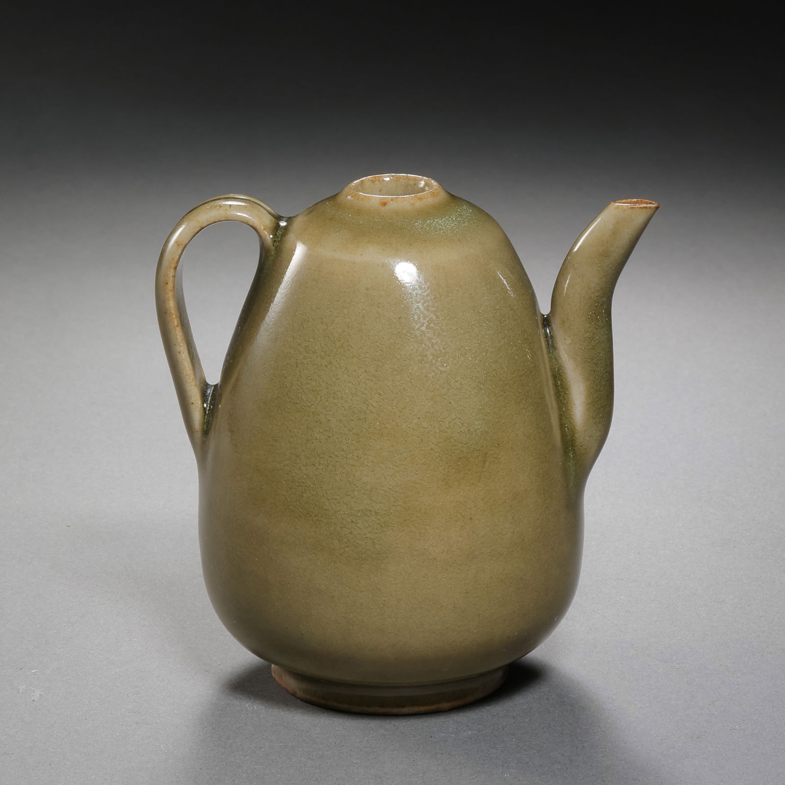 Olive-green glazed ewer from Yaozhou kiln, Northern Song Dynasty, China: H. 8 cm. W. 13.5 cm.