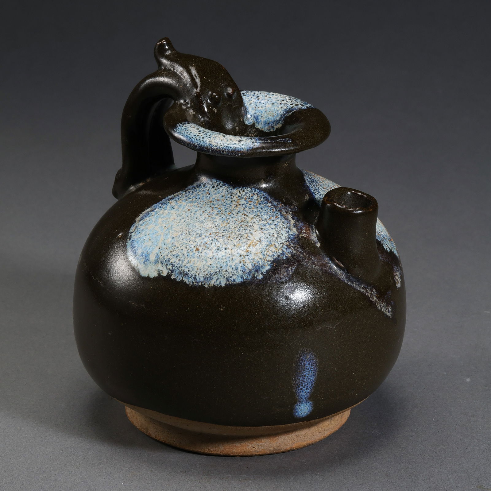 Chinese Tang Dynasty Lushan Flower Glazed Dragon Handle Ewer: H. 10 cm. W. 10.8 cm.